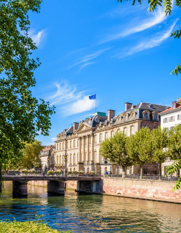 Strasbourg, France - September 18, 2019: Main facade of the Rohan palace facing the river Ill which houses the Archaeological Museum, the Museum of Decorative Arts and the Museum of Fine Arts.